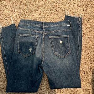 Mother denim with rips